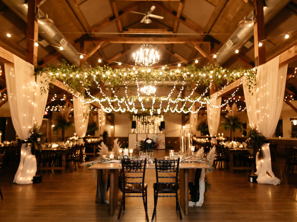 lights along exposed beam ceiling for event room decor